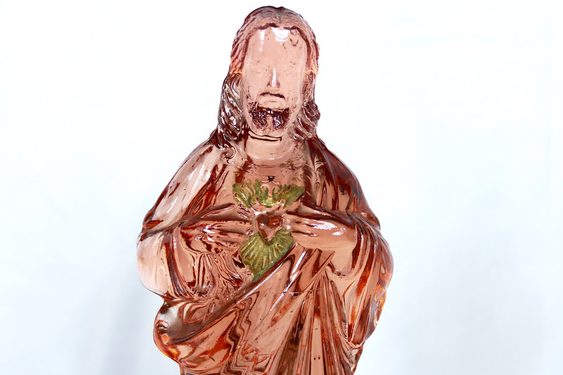 Pink glass Jesus candlestick holder