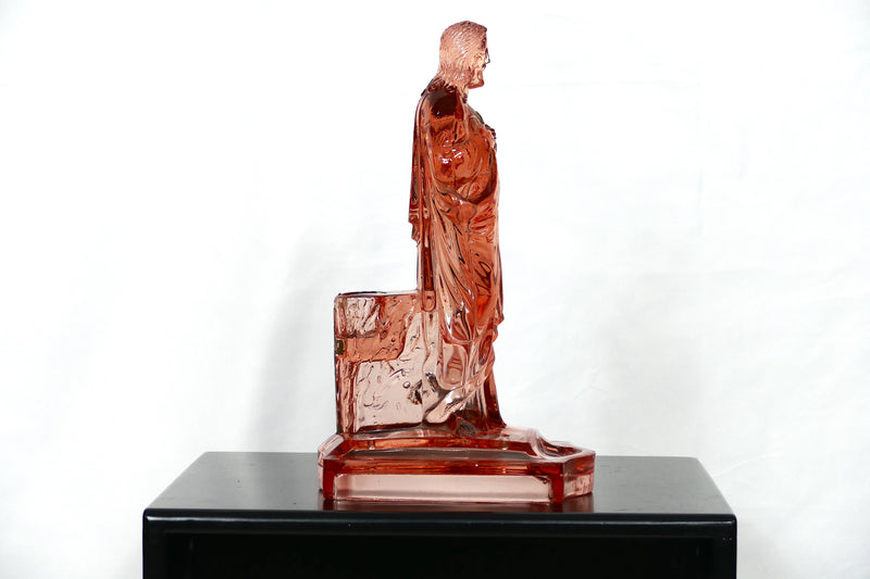 Pink glass Jesus candlestick holder