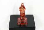 Pink glass Jesus candlestick holder