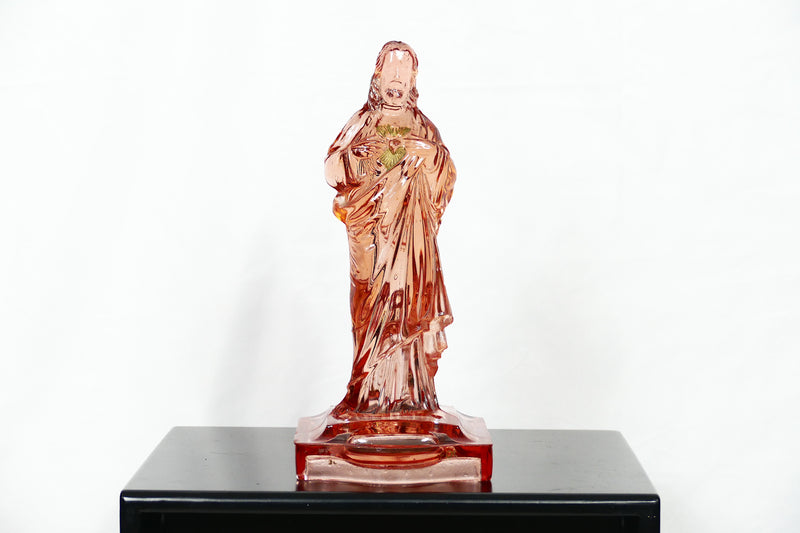 Pink glass Jesus candlestick holder