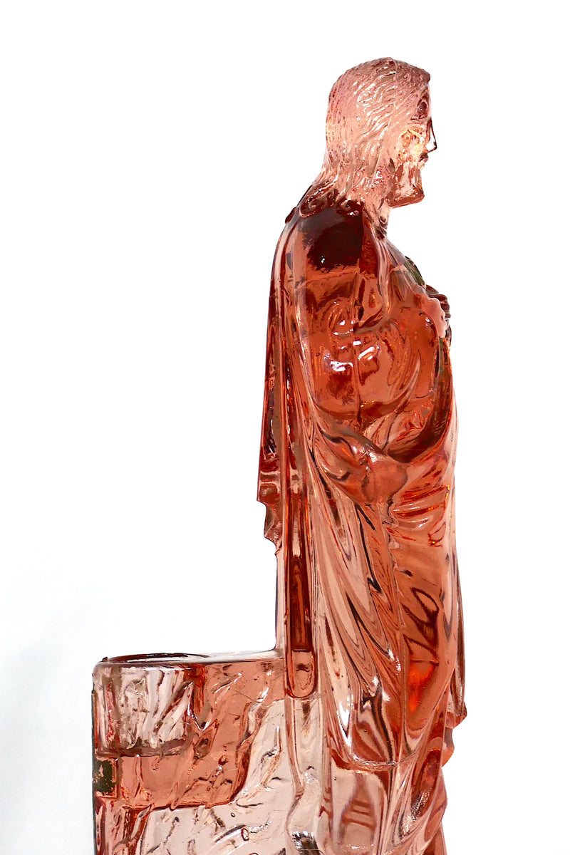 Pink glass Jesus candlestick holder